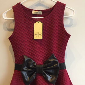 Quilted peplum top with vegan leather bow, NWT